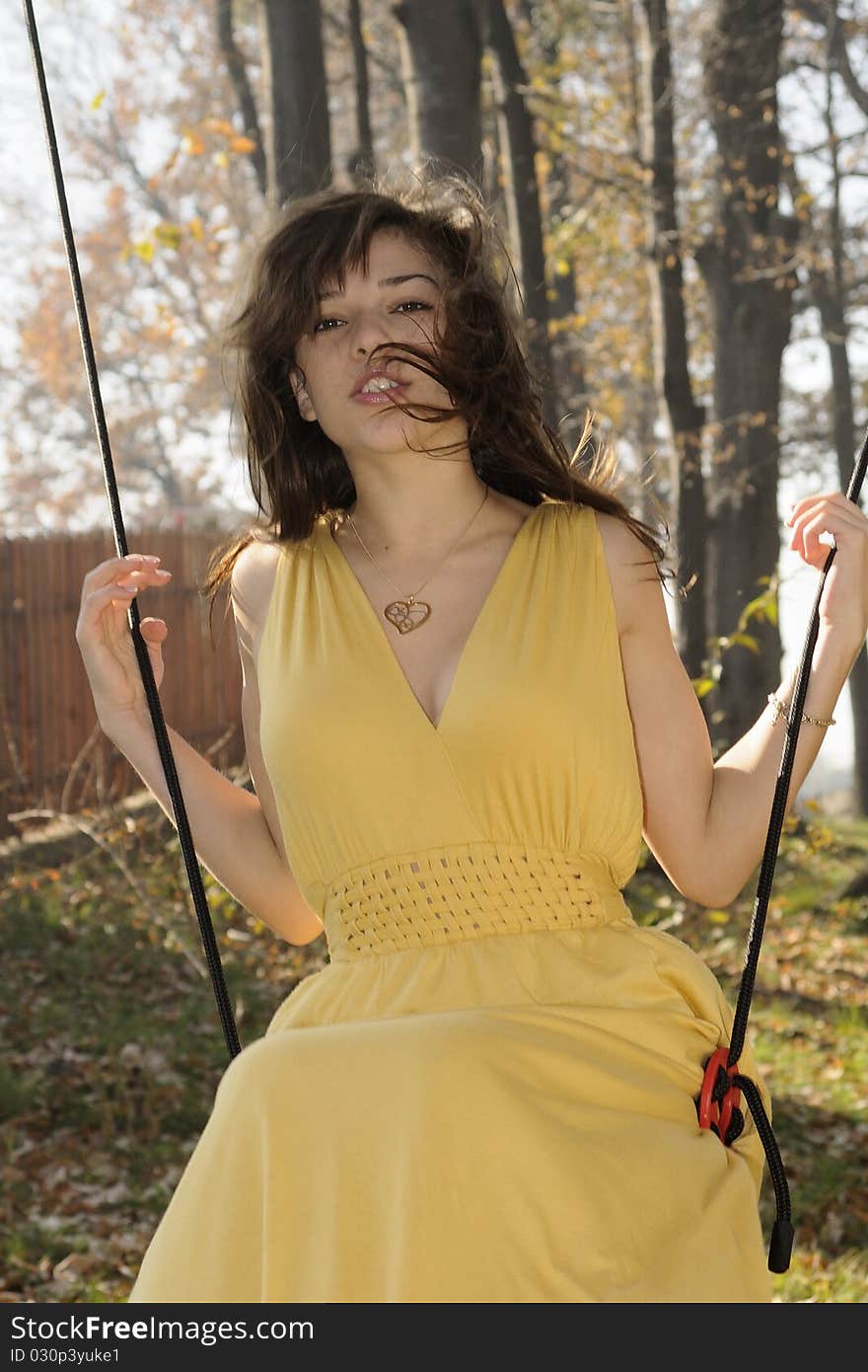 Cheerful Girl Swinging