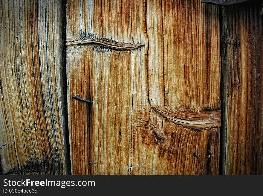 Closeup view of grainy wooden texture with knot