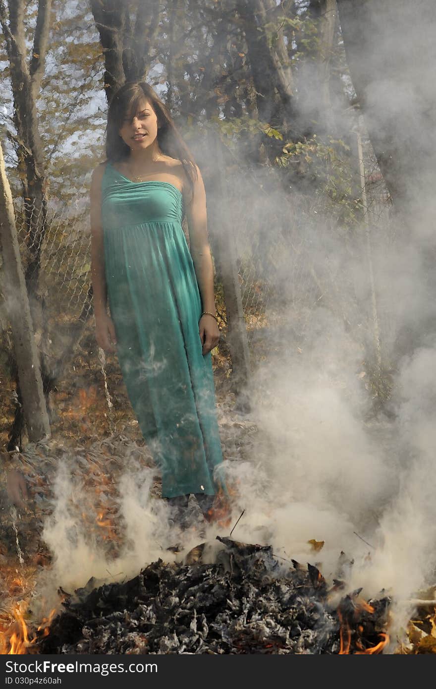 Brunette woman posing in fall season. Brunette woman posing in fall season