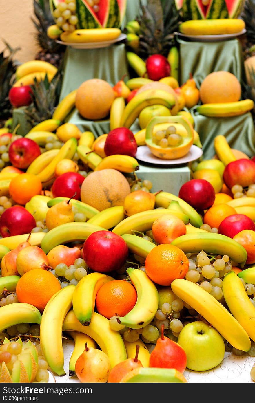 A lot of fruits on a table. A lot of fruits on a table