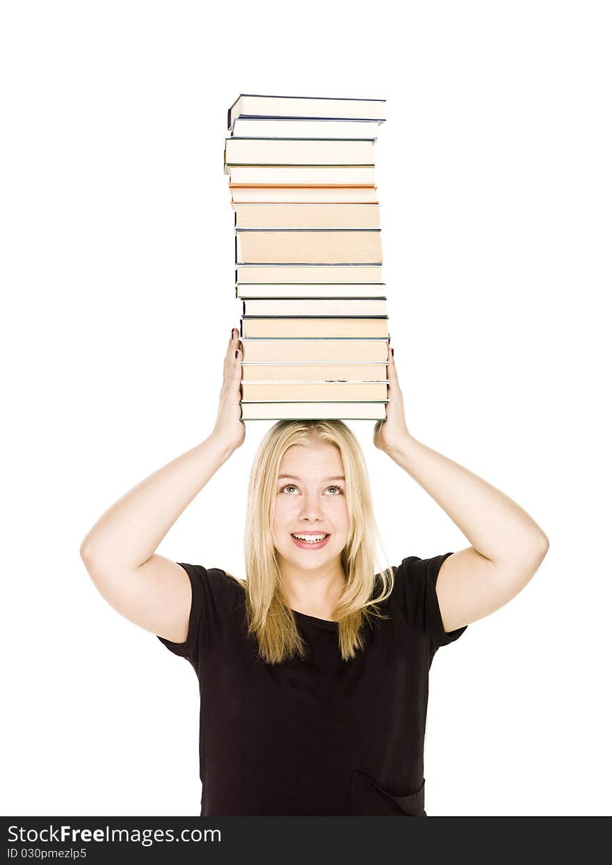 Young woman with a pile of books on her head isolated on white background