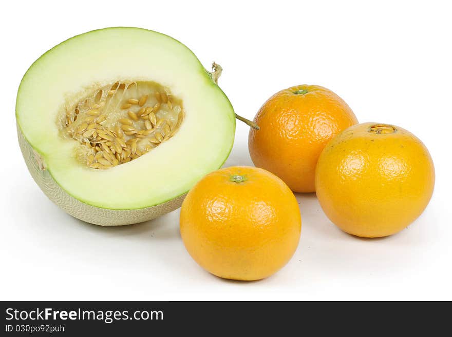 Netted melon and Ripe orange on white