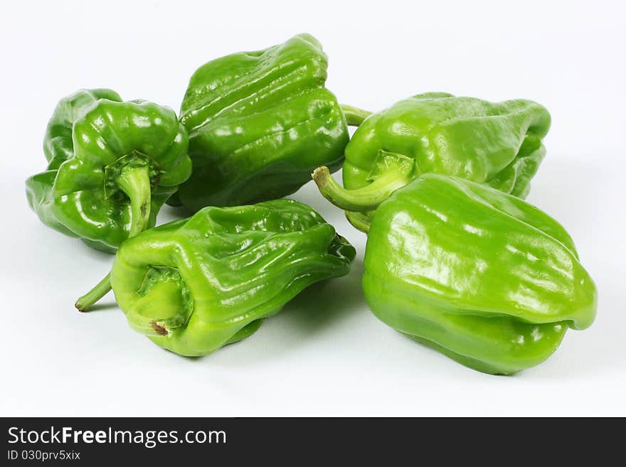 Green pepper on white background