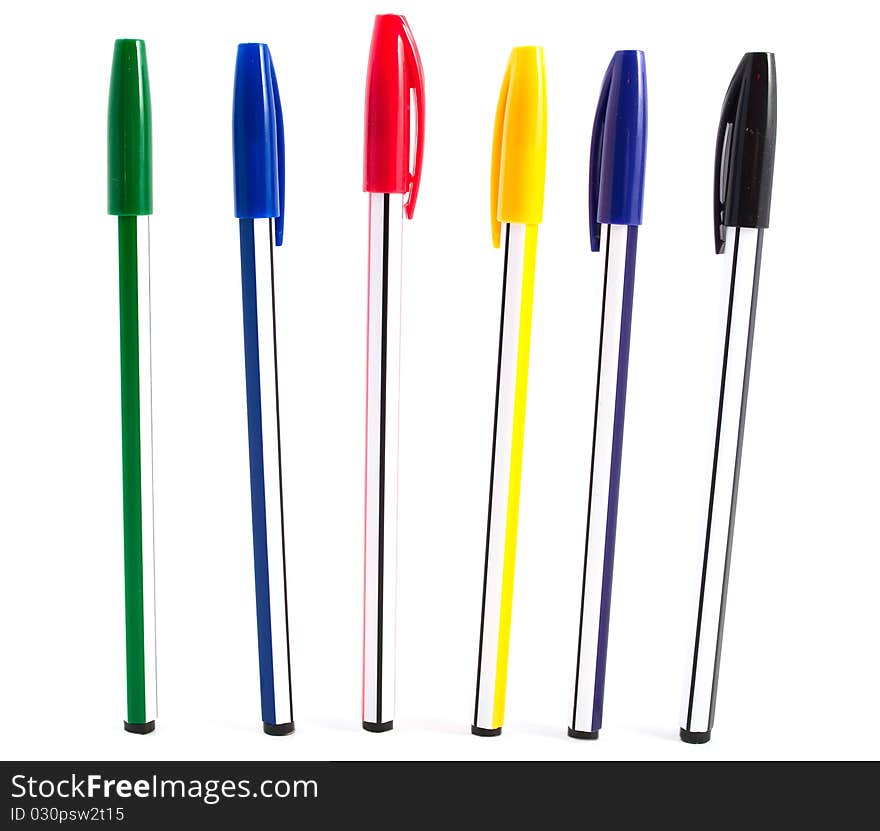 Pens of different colors on a white background