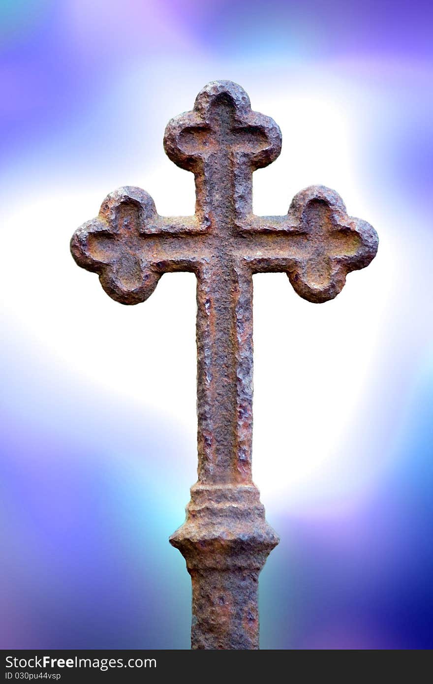 Rusty cross with blue light