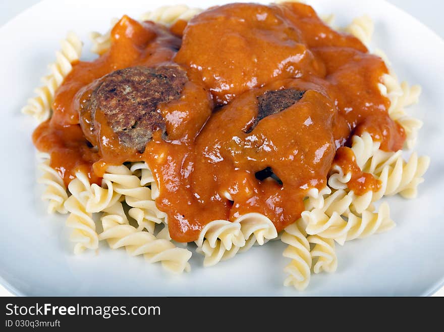 Meatballs with tomato sauce and fusilli