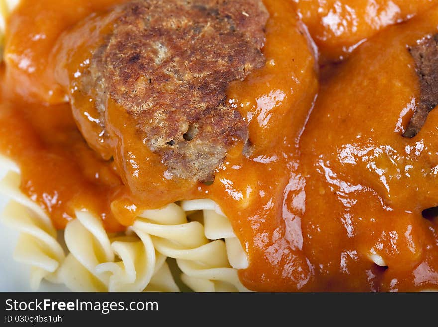 Meatballs with tomato sauce and fusilli