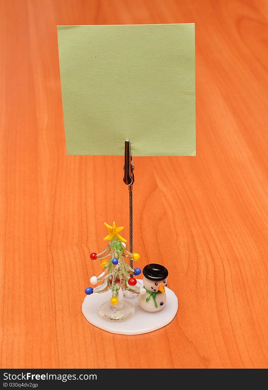 A small stand with a blank card for New Year greetings. A small stand with a blank card for New Year greetings