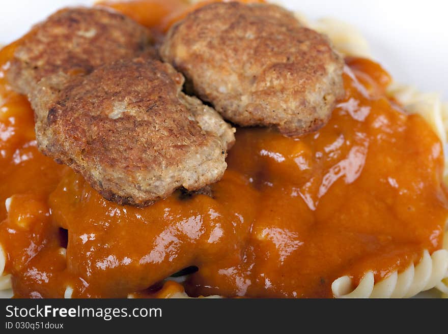 Meatballs with tomato sauce and fusilli