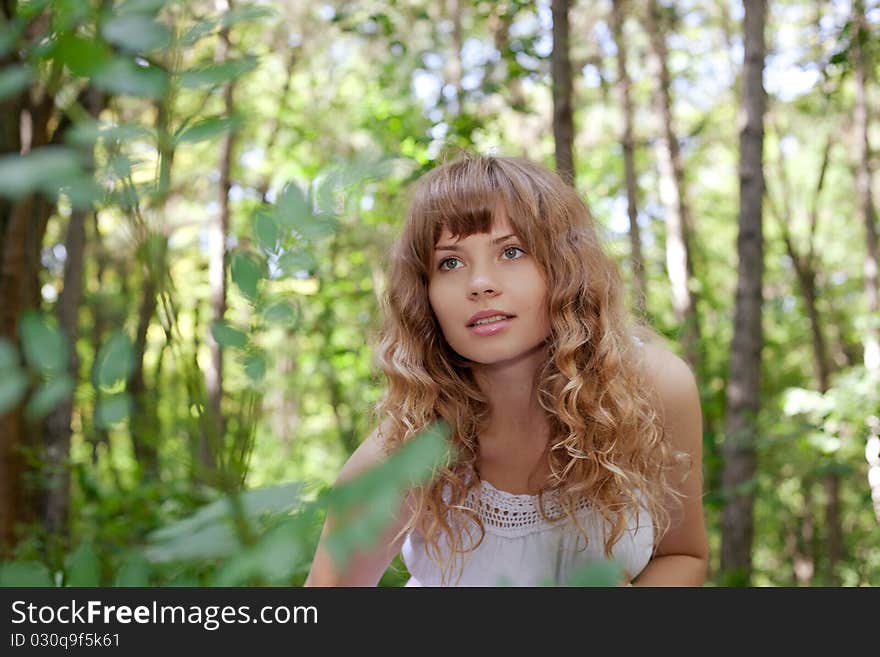 Pretty woman posing in forest. Pretty woman posing in forest