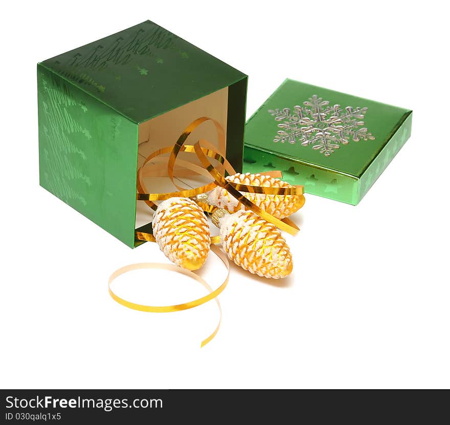 Christmas gift box and cones on white