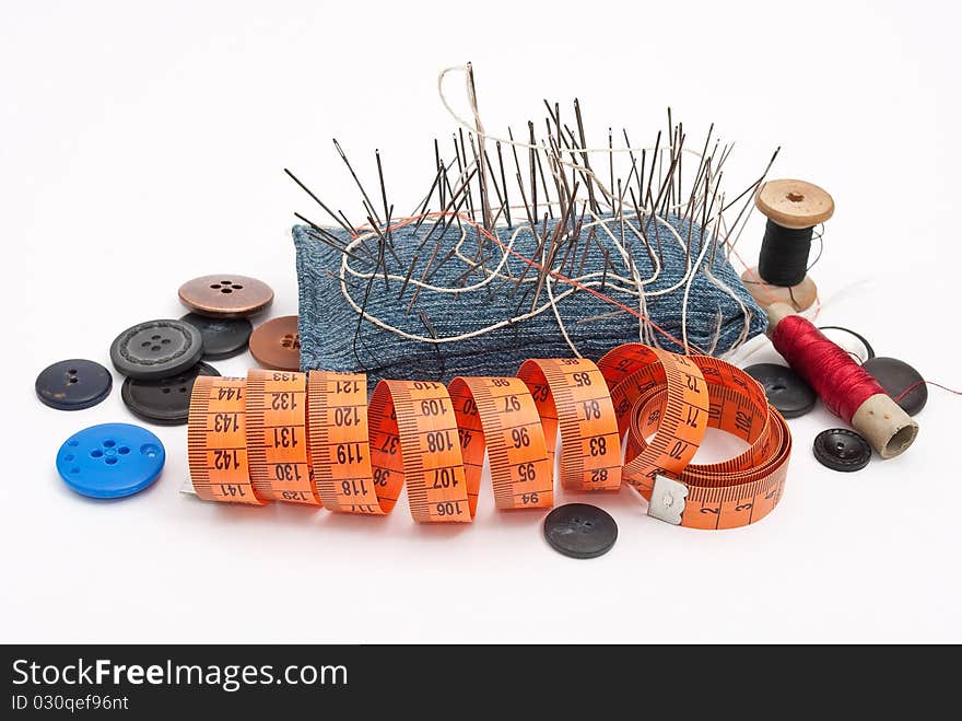 Sewing tools on white background