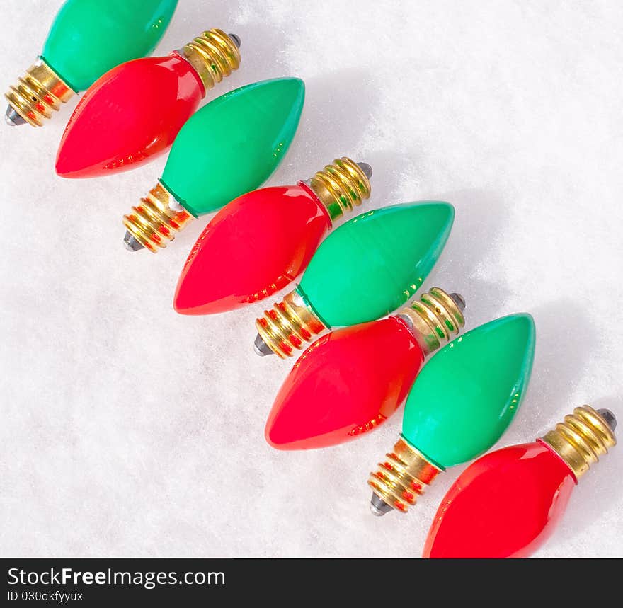 Diagonal row of red and green light bulbs