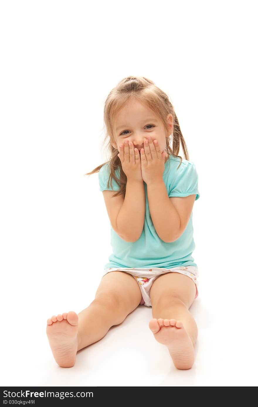 Young girl laughing to the camera on isolated white background.