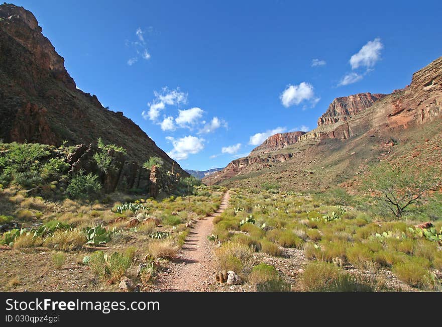 Landscape view of the South Kaibab Trail leading trough the bottom of the Grand Canyon. Landscape view of the South Kaibab Trail leading trough the bottom of the Grand Canyon