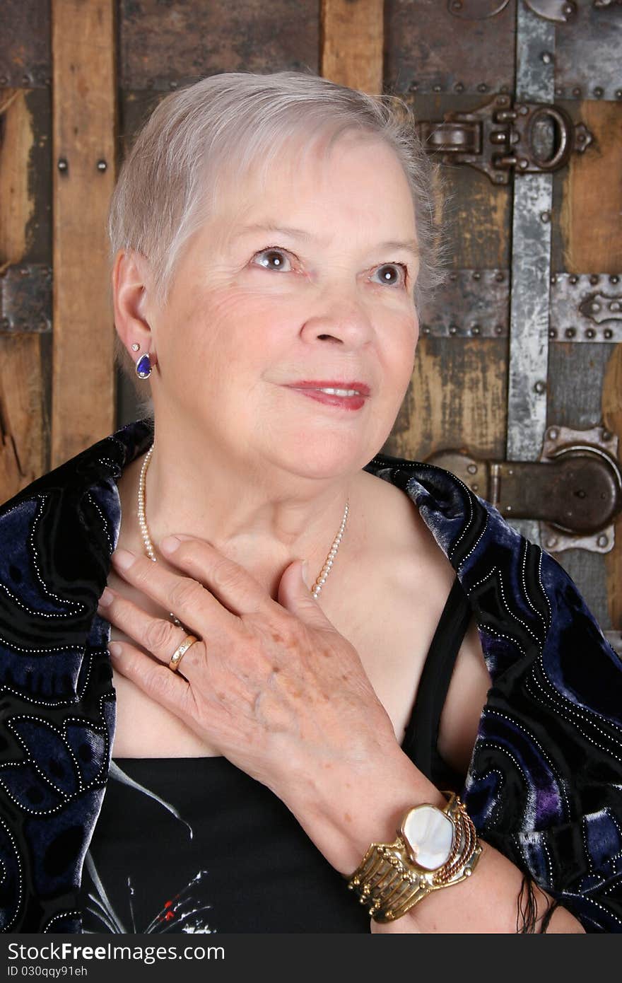 Elegant female wearing antique jewellery and pearls