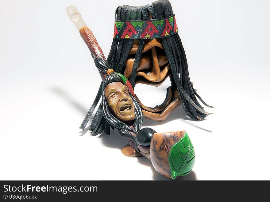 American indian toy mask of  and peace rod. American indian toy mask of  and peace rod