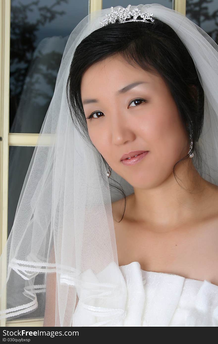 Beautiful Korean bride wearing a traditional wedding gown. Beautiful Korean bride wearing a traditional wedding gown