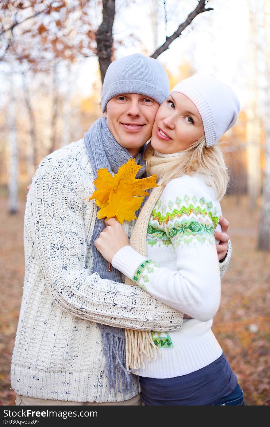 Happy young couple spending time outdoor in the park. Happy young couple spending time outdoor in the park