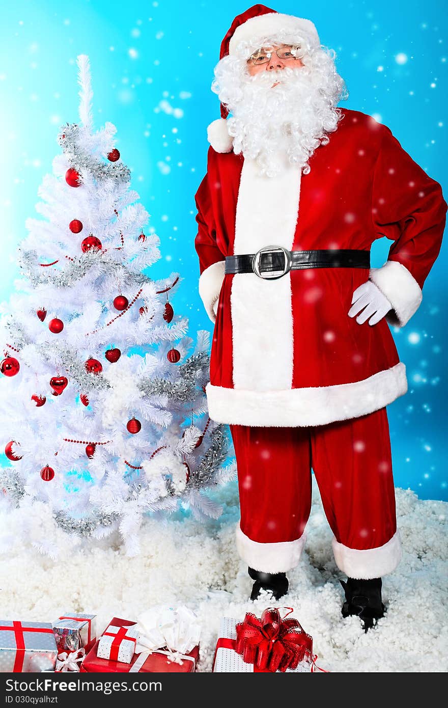 Christmas theme: Santa Claus with presents and christmas tree, over blue background. Christmas theme: Santa Claus with presents and christmas tree, over blue background.