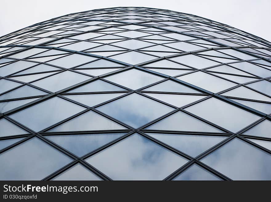 Detail shot from Foster & Partners building Swiss Re, revealing the clouds and sky reflections on the glass façade. Detail shot from Foster & Partners building Swiss Re, revealing the clouds and sky reflections on the glass façade