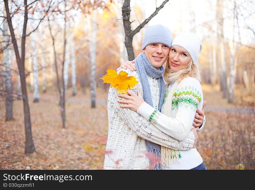 Happy young couple spending time outdoor in the park. Happy young couple spending time outdoor in the park