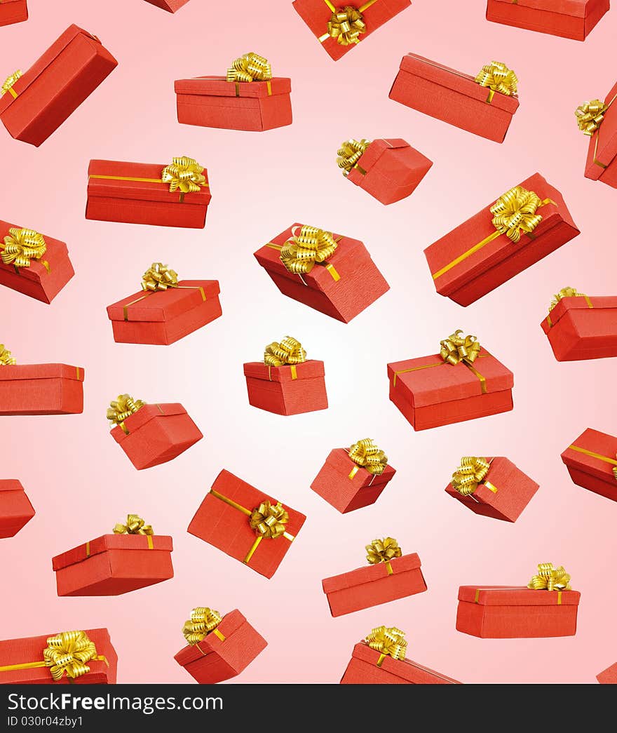 Red gift boxes with ribbon and bow on pink background