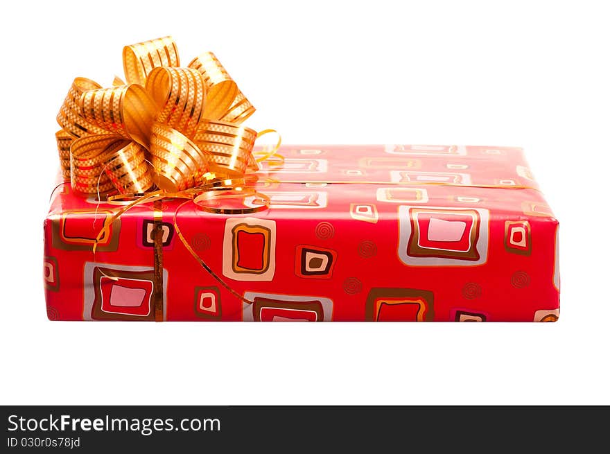 Red gift box with ribbon and bow on white background