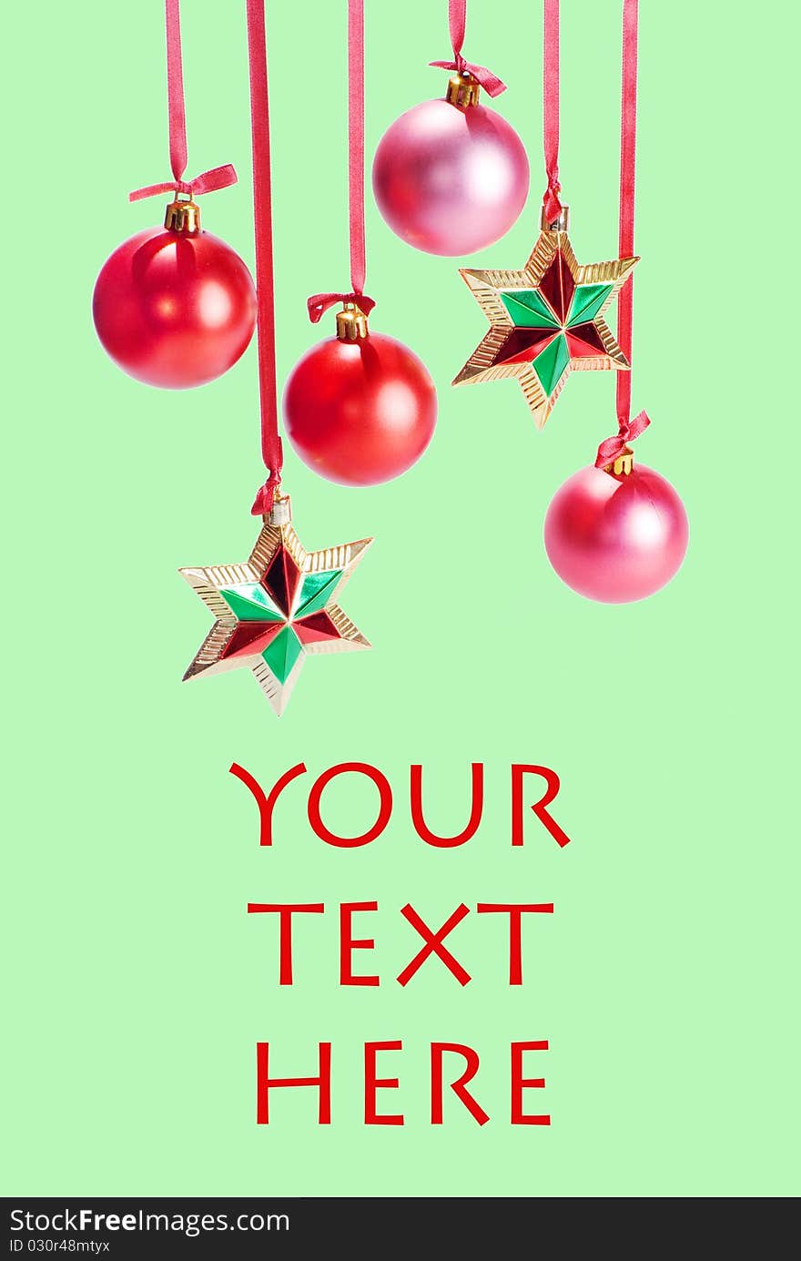 Christmas card with spheres and stars on the green background