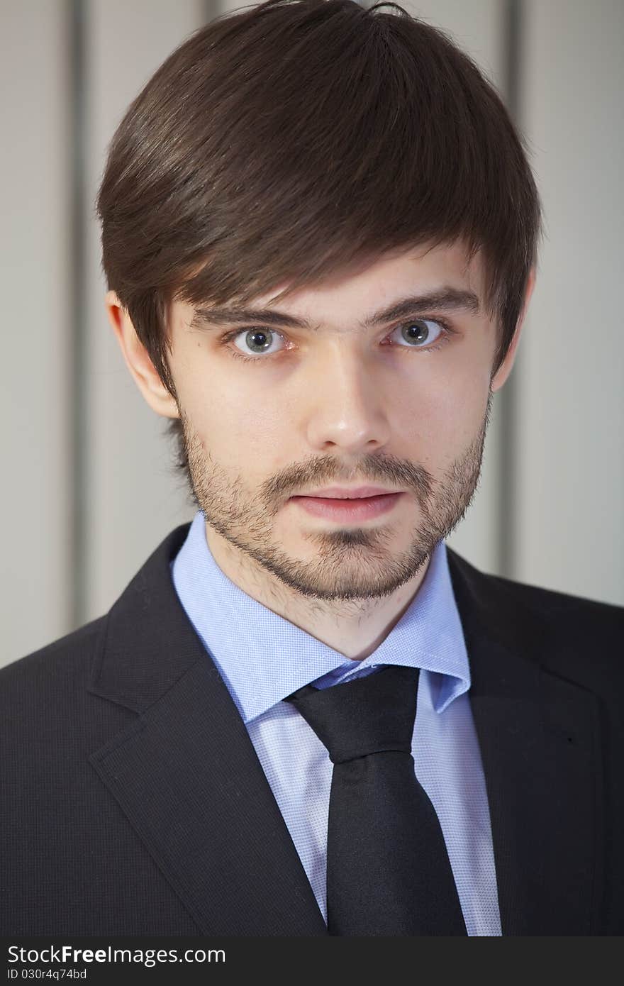 Portrait of young businessman in a office