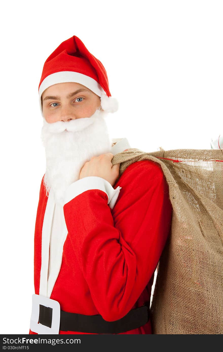 Santa Claus loaded with Christmas gifts