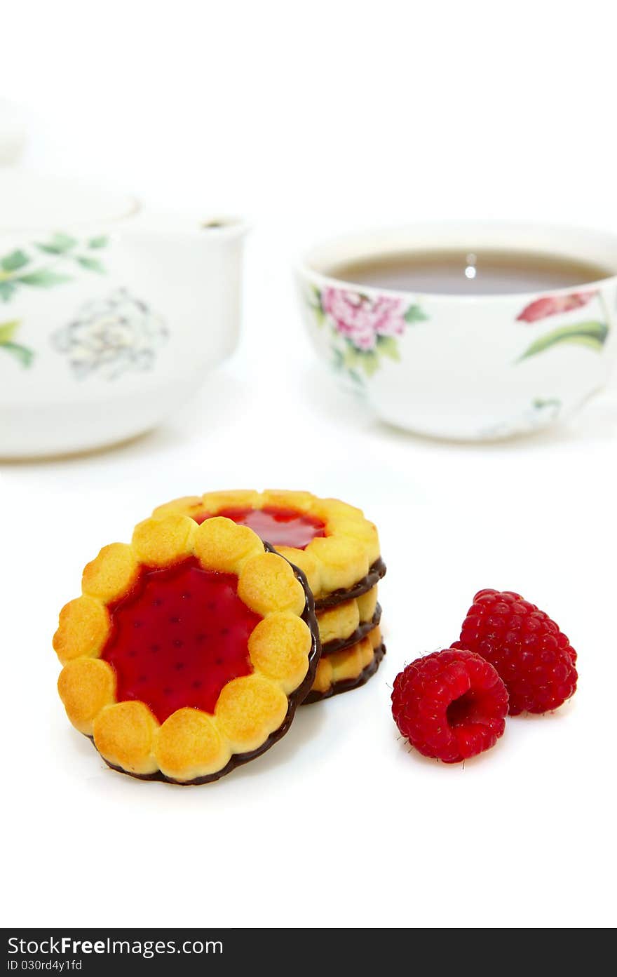 Shortbread cookies with jam centre and chocolate bottom for tea drinking. White background. Shortbread cookies with jam centre and chocolate bottom for tea drinking. White background.