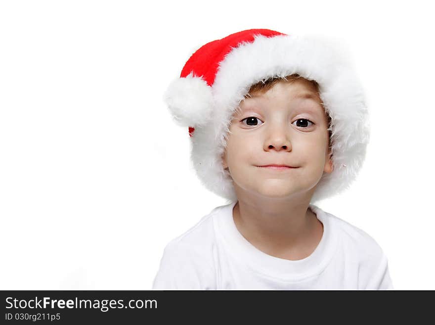 Studio portrait of funny child in santa hat