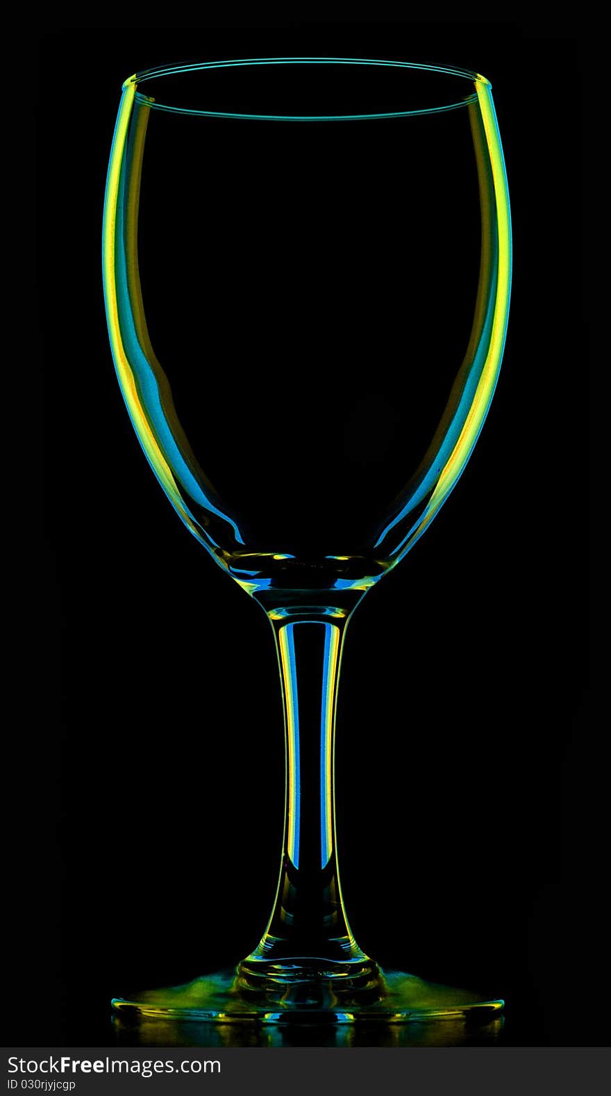 Transparent colored empty wine glass, isolated on black. Transparent colored empty wine glass, isolated on black