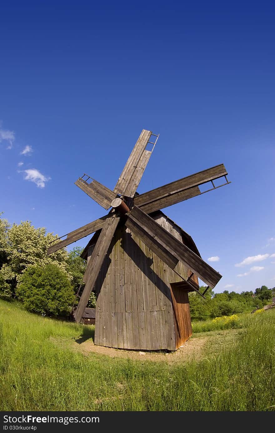 Windmill on green field from Ukraine