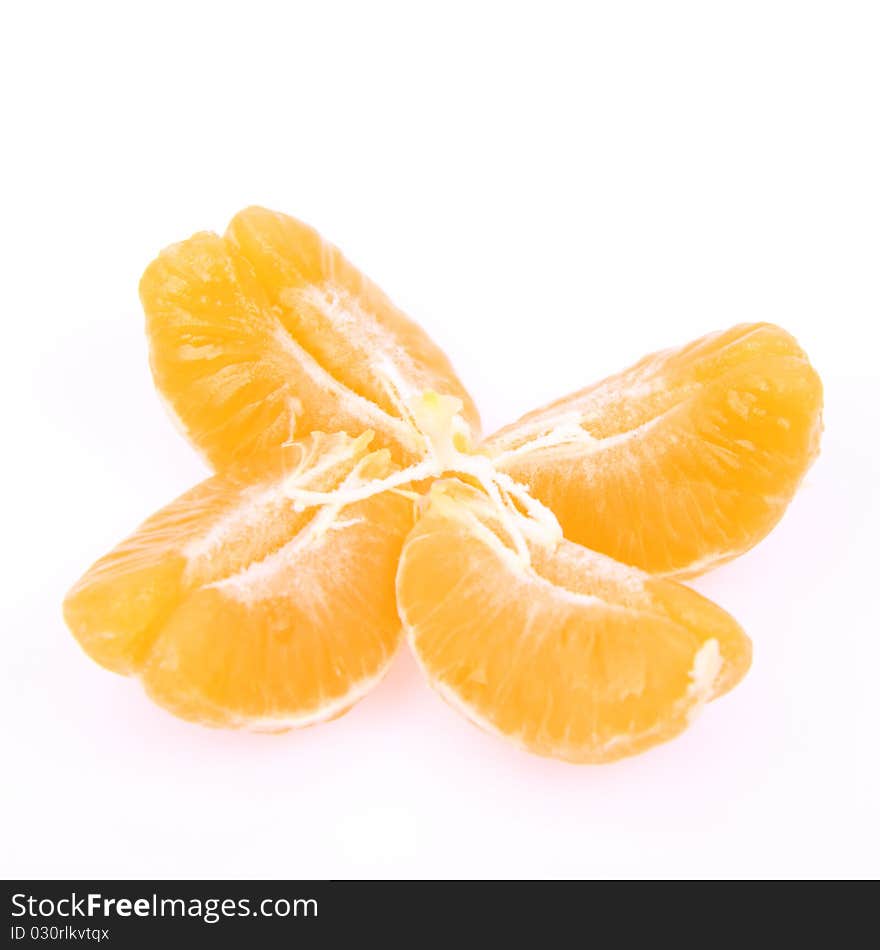 Segments of a peeled mandarin on white background. Segments of a peeled mandarin on white background