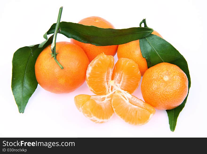 Mandarin oranges one peeled, on white background