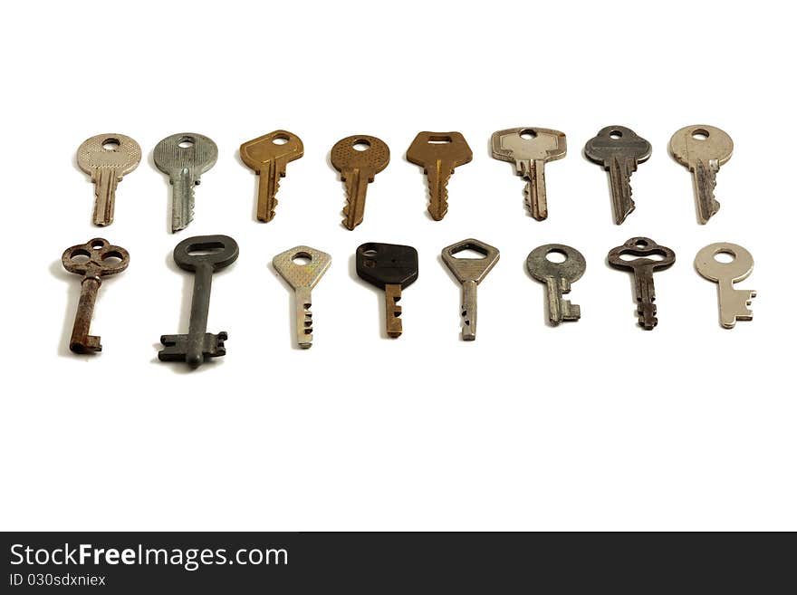 Lots of old keys on white background