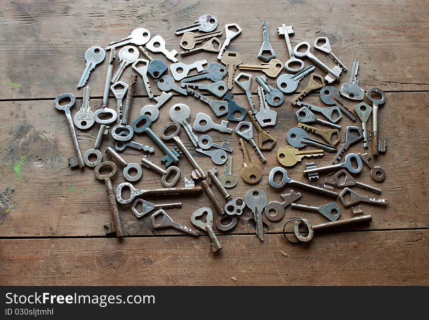 Lots of keys on wooden table