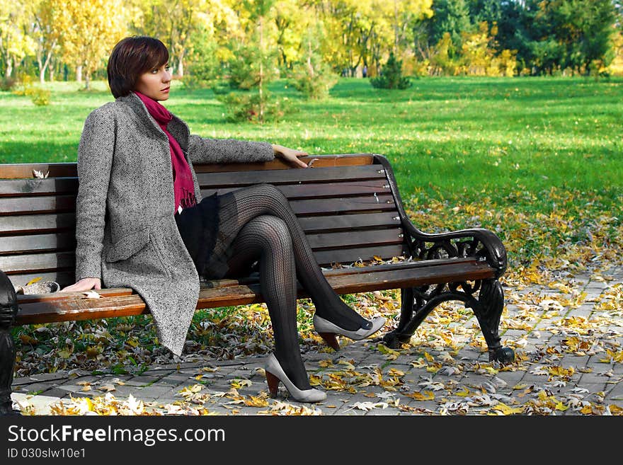 Girl in the park on a bench