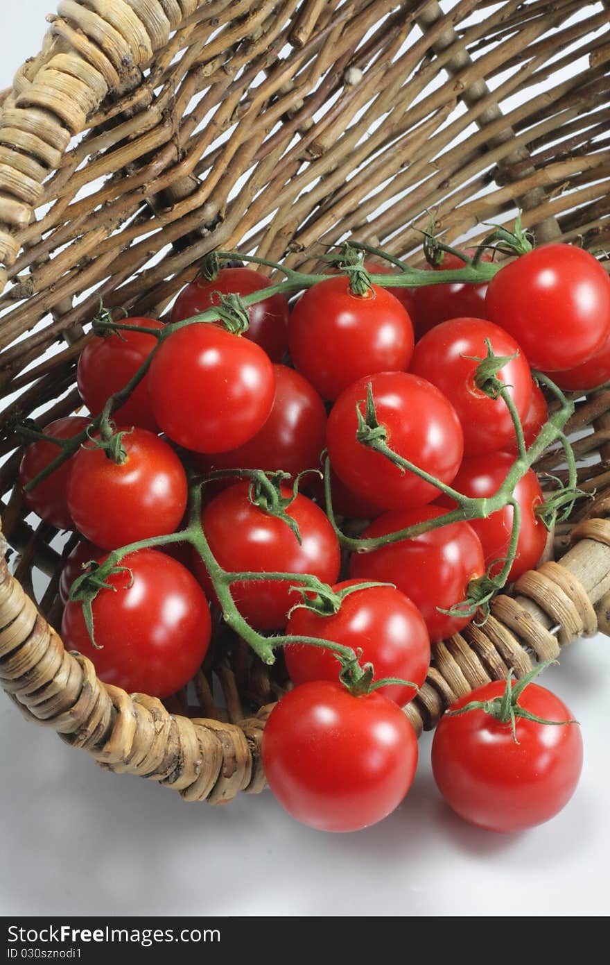 Basket of red organic tomatoes