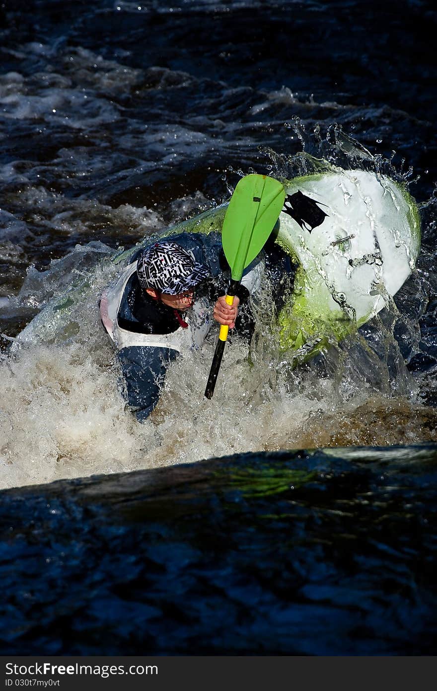 Competition of kayak freestyle on whitewater