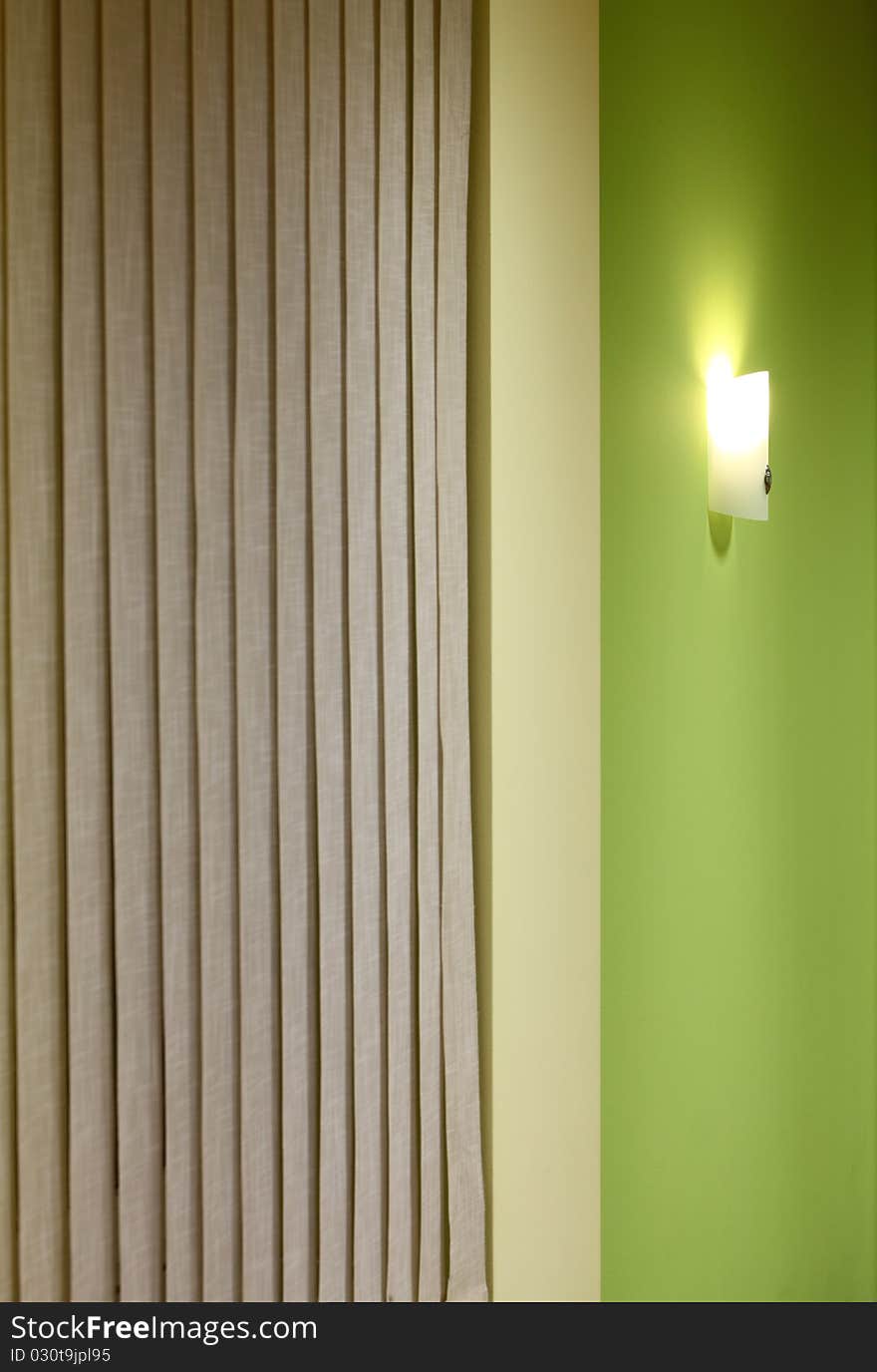Wall lamp on the green background