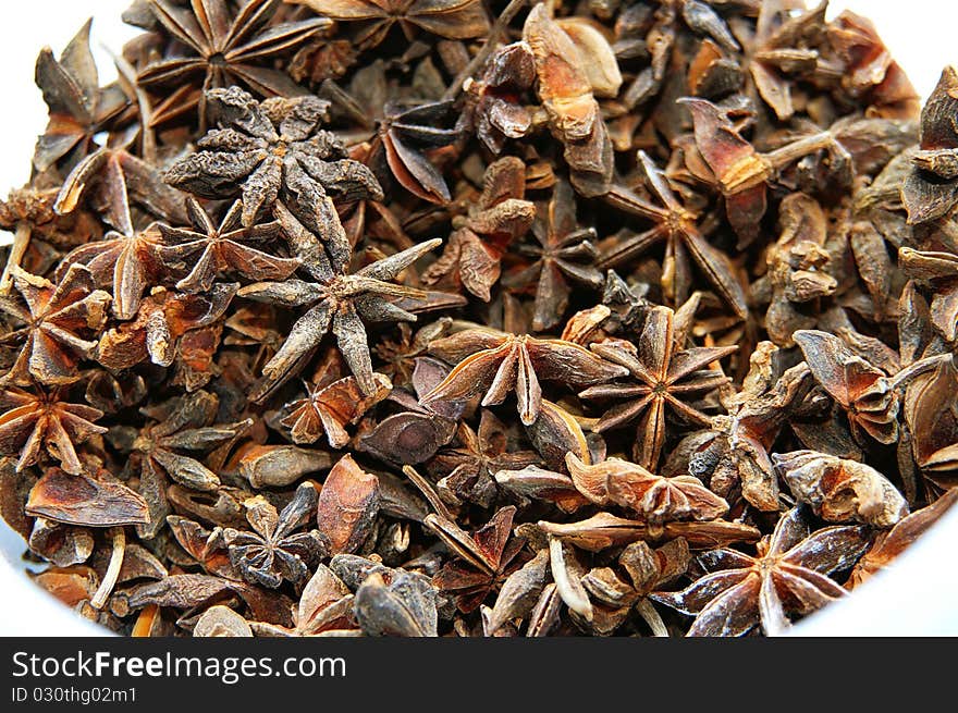 A bucket full of anises to be used in spicy cooking. A bucket full of anises to be used in spicy cooking.