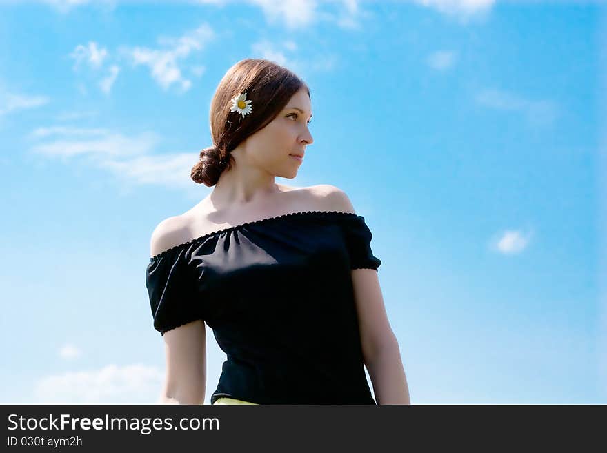 Pretty young woman with camomile in hair. Pretty young woman with camomile in hair