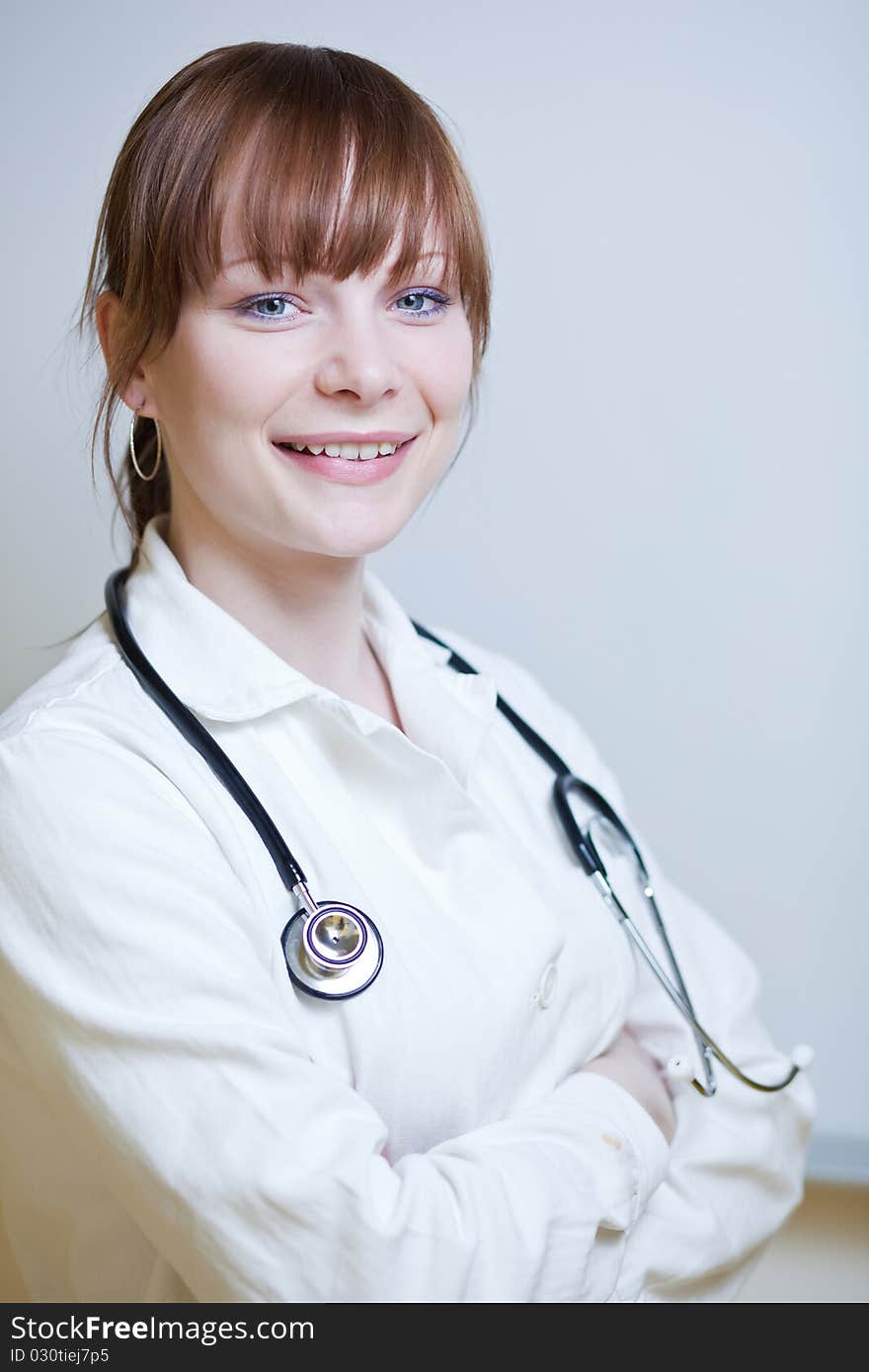 Portrait of a successful young female doctor, looking confident(color toned image)