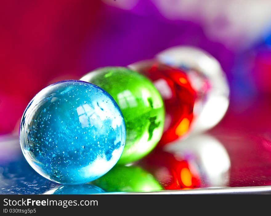 Marbles on colorfull blurred background