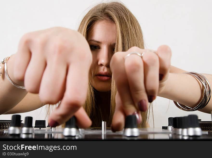 Female DJ adjusting sound levels