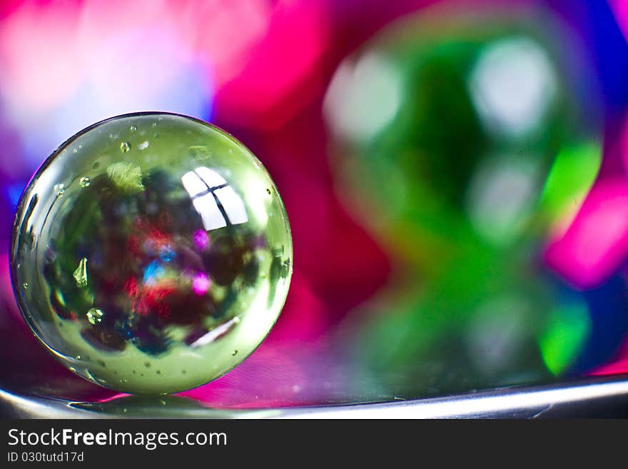 Marbles on colorfull blurred background