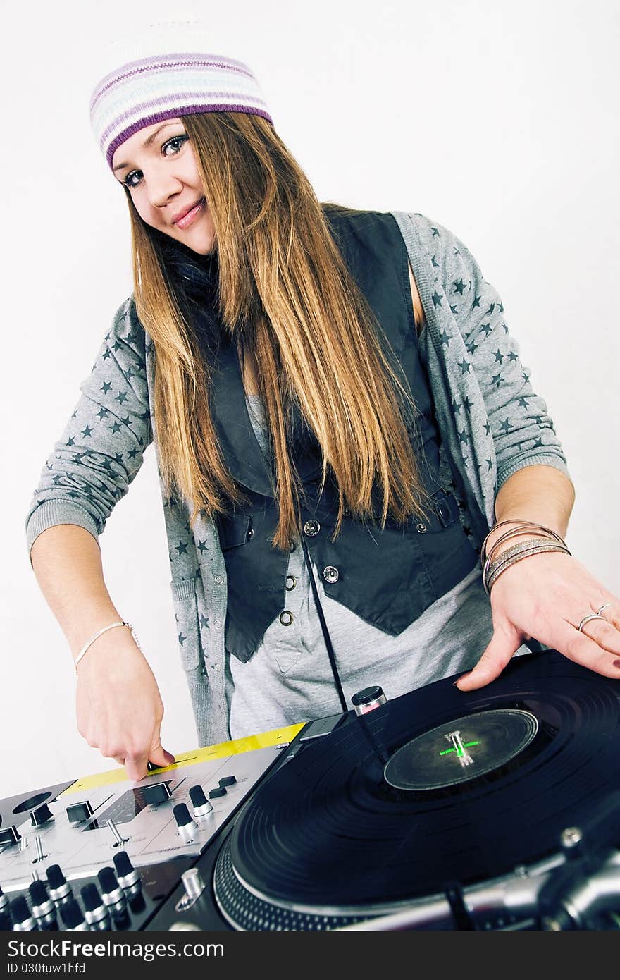 Young attractive teenage girl playing music from turntable. Young attractive teenage girl playing music from turntable